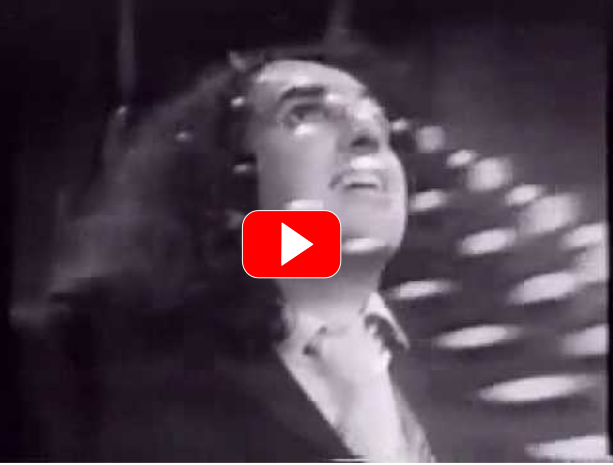 American variety artist Tiny Tim performs with his song
            "The Other Side" in a children's show on TV